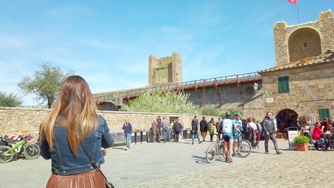 Monteriggioni Siena, IT - Mar 2019: Panning gimbal main square of the medieval village within the defensive walls - Tuscany; architecturally significant, referenced in Dante Alighieri's Divine Comedy