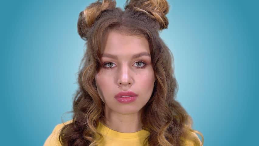 Beautiful young girl in a good mood smiling looking into the camera. close-up