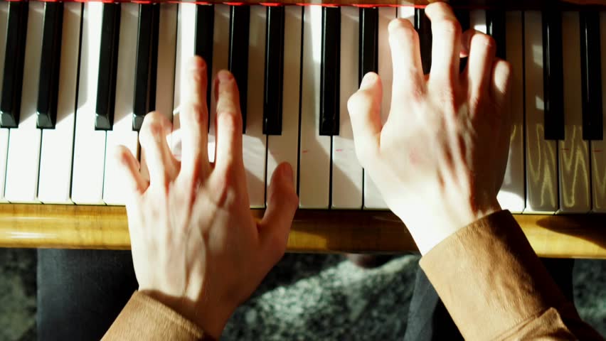 The pianist performs playing a grand piano. Hands close up. Professional pianist. Royalty-Free Stock Footage #1026084017