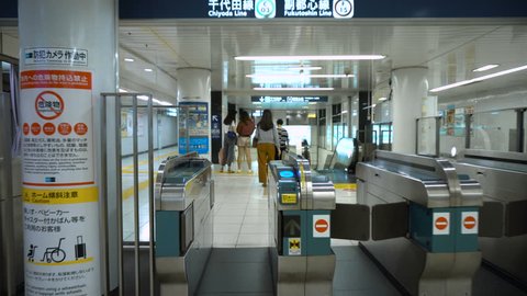 Entering Subway Station and Walking Through Turnstiles in Tokyo, Japan - September 2018
