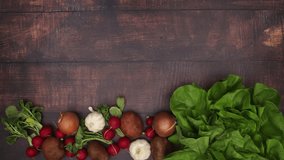Vegetables on wooden background. Stop motion animation video. 