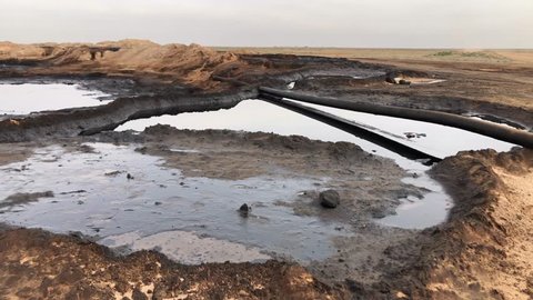 Syria - March 19, 2019: Oil pipeline leak in the desert