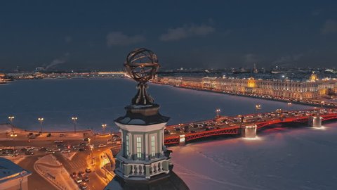 Night aerial view of the Dome of the Kunstkamera on the University Embankment, in the background - frozen Neva river, Palace Bridge and Hermitage. Saint Petersburg, Russia