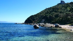 Sea In Sardinia In Spring People Strolling, Lean And Take The Sun 4K Video
