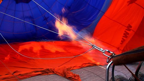 fire from jet blows hot air balloon
