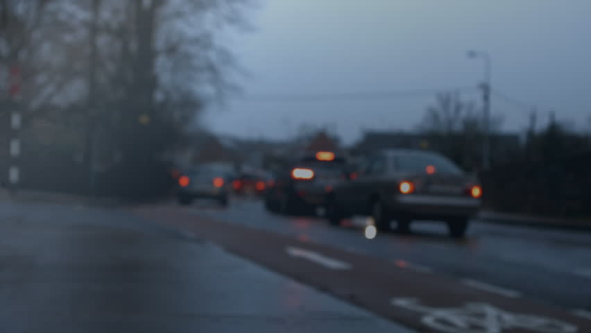 Digital composite of cars driving on city road while binary codes and clouds moving on the foreground. - Powered by Shutterstock - Get 15% off with code: PIKWIZARD15