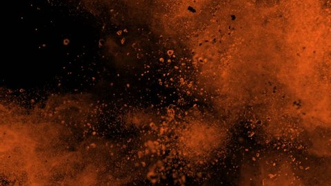 Super slowmotion shot of golden powder explosion isolated on black background.