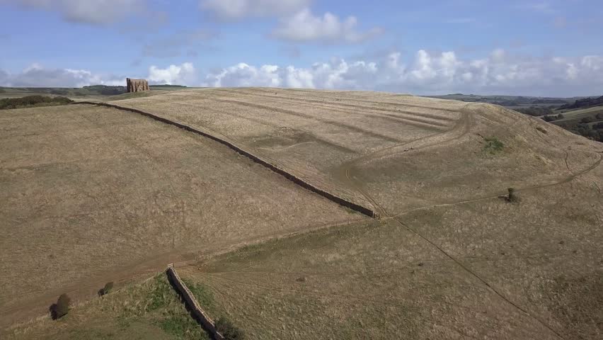 Forward tracking aerial towards the bottom of the hill that St Catherine