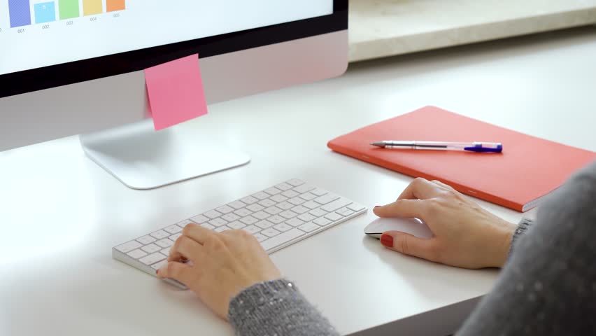 Female hands with red nails use mouse and typing on white computer keyboard | Shutterstock HD Video #1026136133