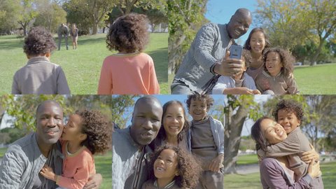 Afro-american young bald father sitting on haunches in park, making selfie of his family with kids, mother waving hand, kissing children. Family, holiday concept