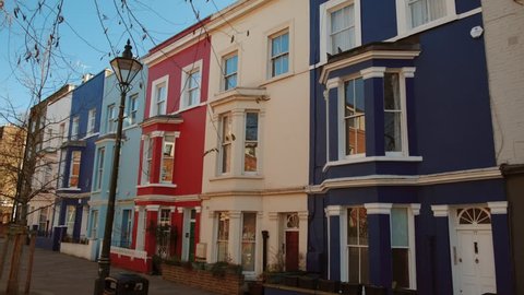 LONDON, circa 2019 - POV shot of beautiful and colorful Victorian houses in Portobello Road, Notting Hill, close to the famous Antiques Market