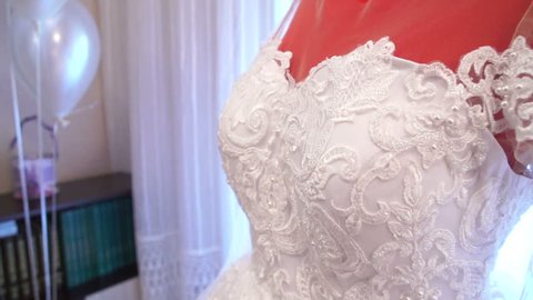 Wedding dresses at home on mannequin. Preparation for the wedding