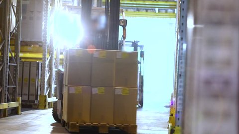 Active work of forklifts in a large modern warehouse, industrial interior, work of forklifts in a warehouse, workflow in a warehouse
