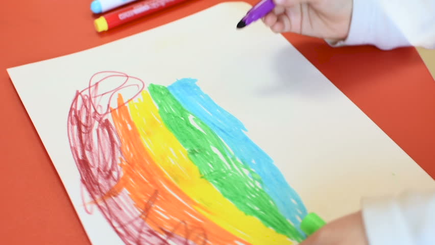Rainbow on a sheet of paper. Little girl drawing a rainbow on a white sheet of paper with felt-tip pens. | Shutterstock HD Video #1026163604