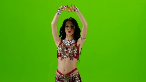 Dancer in red dress. Green screen. Slow motion