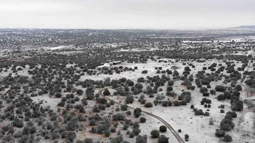 Farm in Santa Rosa NM snow landscape over desert