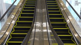 4K video of close up empty escalator staircases moving up and down