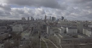 4K. Aerial view of tall buildings and city streets in Warsaw Poland. Video filmed from drone in RAW.