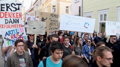 Erfurt, Germany – Mar. 23,2019: walking german sign slogan protest march demonstration against new copyright law “Artikel 13”. Protester got called bots by CDU. More than 100.000 protesters in Germany