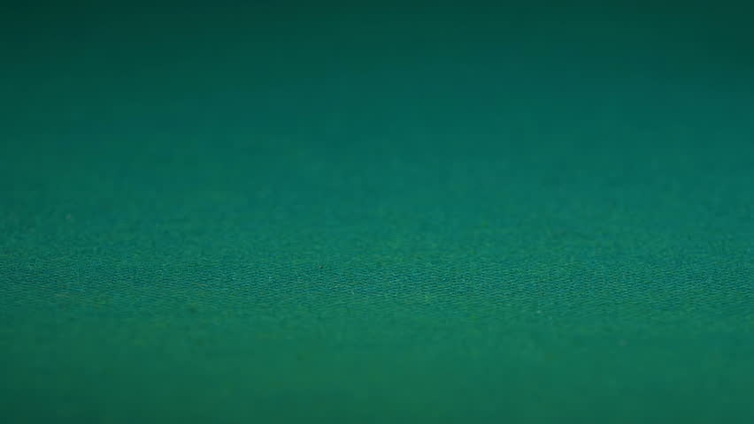 Red chips falling on desk, person satisfied with casino game victory, close-up