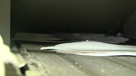The process of destruction of paper documents on an industrial shredder