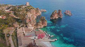 Picturesque spring scene of Tonnara di Scopello. Colorful view of Sicily, Italy, Europe. Wonderful morning seascape of Mediterranean sea. 4k drone forward video (Ultra High Definition).