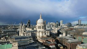 Aerial drone video of iconic Saint Paul landmark Cathedral in the heart of City financial district of London, United Kingdom