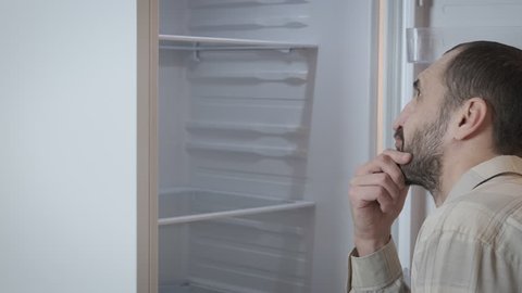 Man Looks Into Empty Fridge Stock Footage Video (100% Royalty-free 