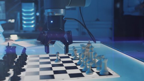 Close Up Shot of a Artificial Intelligence Operating a Futuristic Robotic Arm in a Game of Chess Against a Human. Robot Moves a Pawn. They are in a High Tech Modern Research Laboratory.