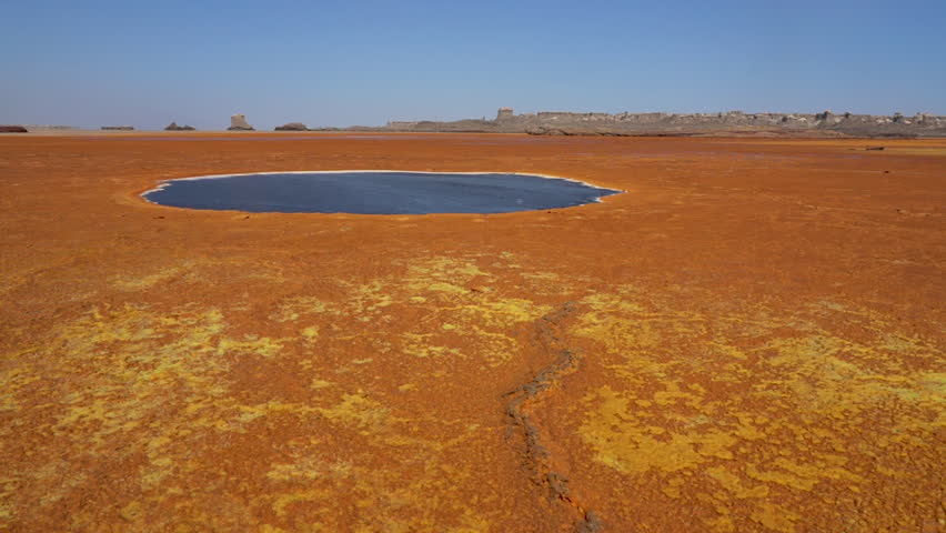 Black poisonous lake in the Danakil depression in Ethiopia, Africa.	