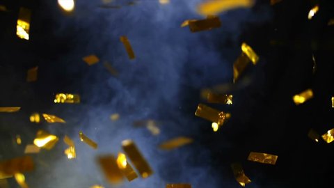 4K Realistic Golden Confetti Party Popper Explosions with Smoke on a Black Background .  Super Slow Motion , Realistic Video Background ... You can use blending mode (screen).