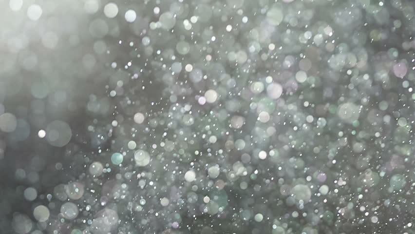 Particle Backgroud Texture: Abstract Floating Dust Particles. Ethereal background abstract texture with bright dust particles shining and sparkling as they slowly float around.