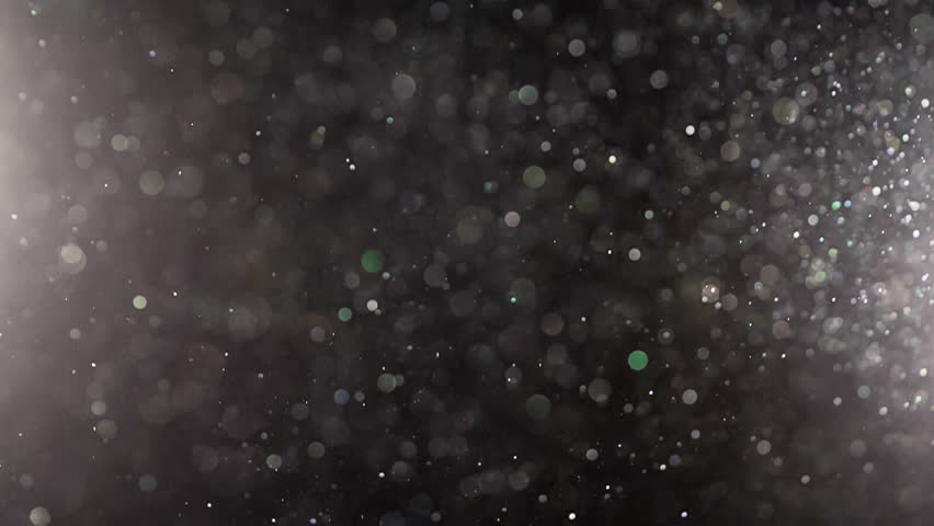 Particle Backgroud Texture: Abstract Floating Dust Particles. Ethereal background abstract texture with bright dust particles shining and sparkling as they slowly float around.