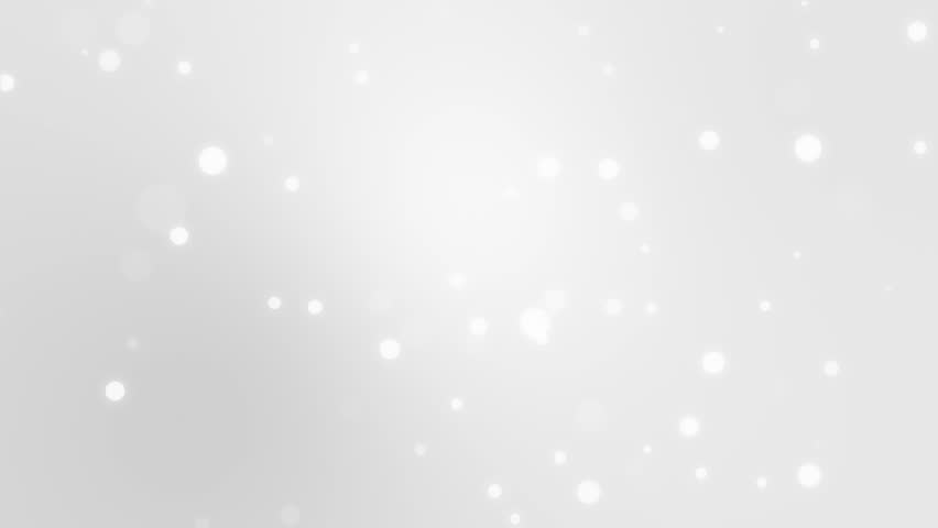 Glowing silver white bokeh background with floating light particles.