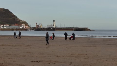 People walk on the beach at Scarborough, North Yorkshire, England 16 ?February ?2018