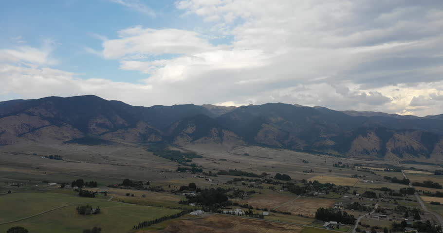Aerial shot above Bridger Mountain Range in rural Montana during early fall.