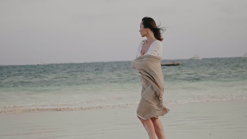 Beautiful woman relaxing near the ocean