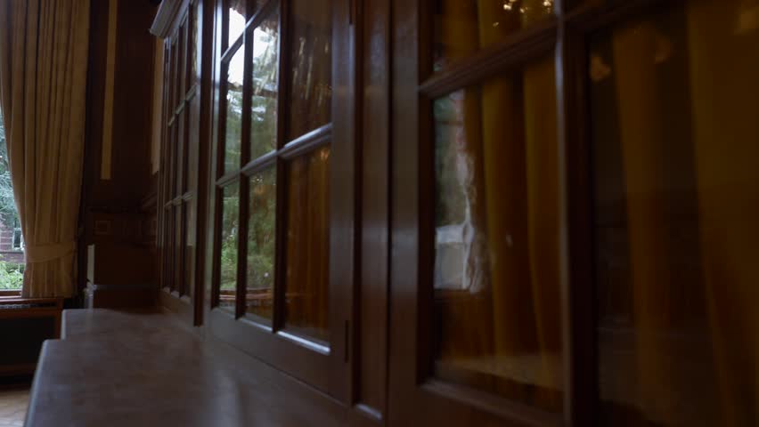 A pan revealing the insides of a typical Amsterdam house, with wooden window frames.