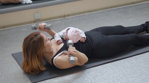 Young mum training with her baby