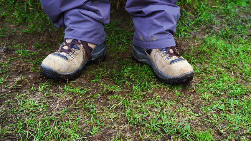hiking boots green grass