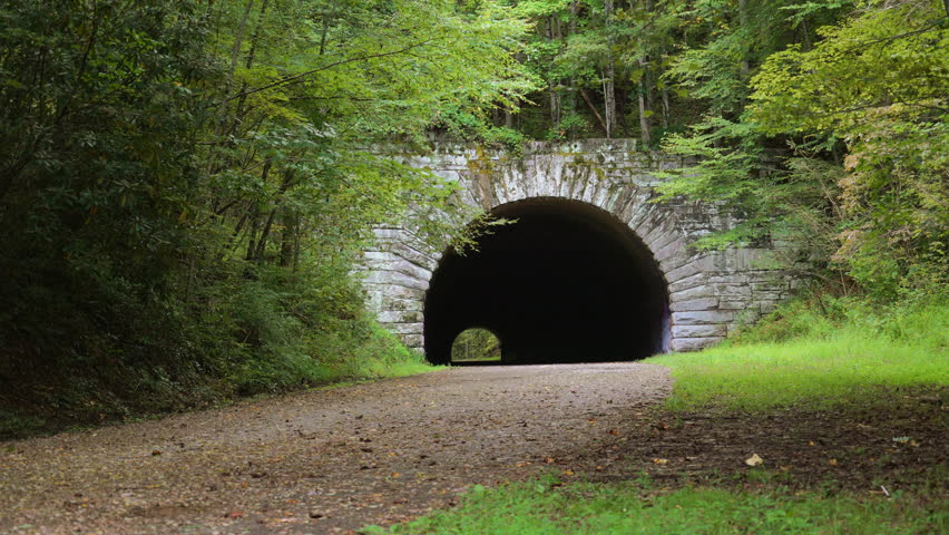 The creepy, dark silhouette of people in a dark tunnel on "the Road to Nowhere" in Bryson City, North Carolina.