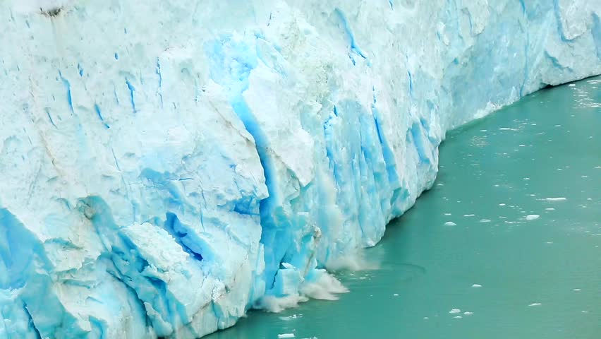 The movement of the glacier, which gives the lake Argentino huge blocks of ice. Ice detaches and falls into the Icebergs Channel. Royalty-Free Stock Footage #1026286025