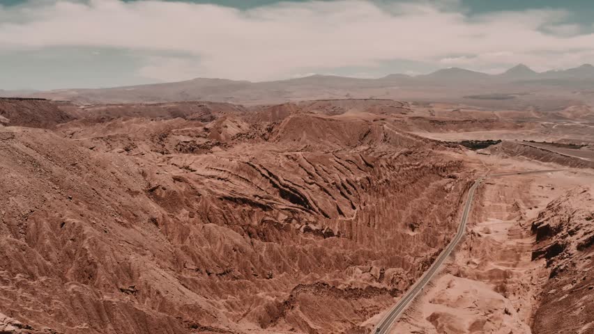 Aerial, Valle De La Luna, Atacama Desert, Chile - cine version. This clip is available in three different gradings - native 10Bit HLG (H265) or flat, cine grading and neutral grading. | Shutterstock HD Video #1026286526