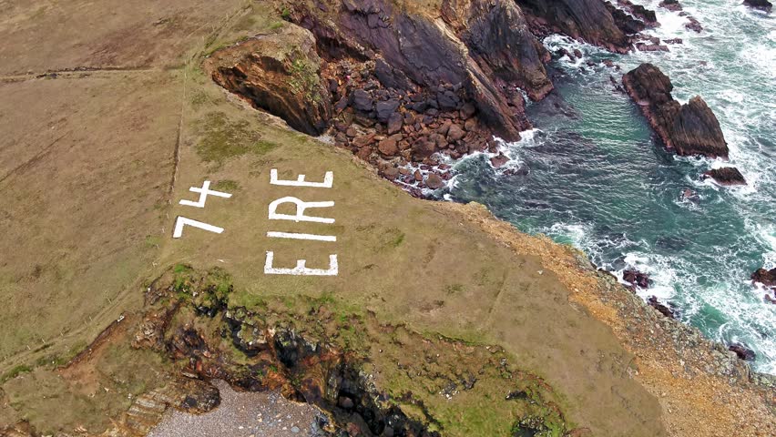 Flying over the coastline of the Wild Atlantic Way by Maghery with the Eire 74 sign, Dungloe - County Donegal - Ireland.