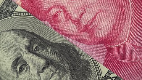 China yuan and US dollar bill rotating. Chinese and USA trade. 4K stock video footage