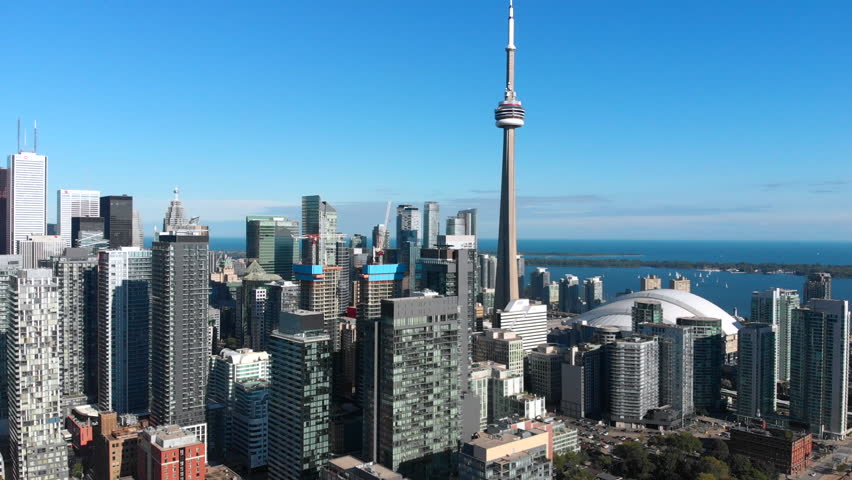 Toronto, Canada, aerial view of office buildings and architectural landmark CN Tower in Downtown Toronto. Royalty-Free Stock Footage #1026290987