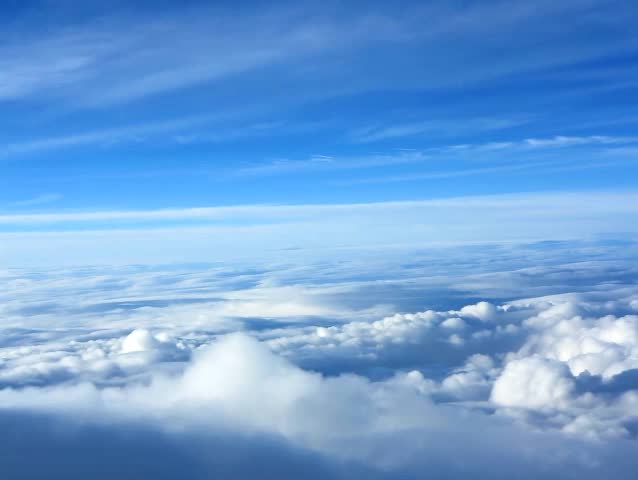 Plane flight above the clouds