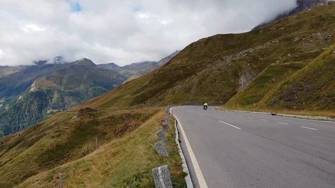View over mountains filmed from the Grossglockner alpine road in Austria on a cloudy day.