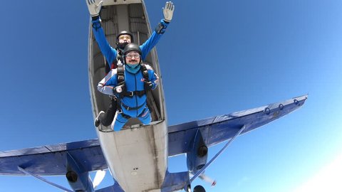 Tandem skydiving. Two guys are flying in the sky.