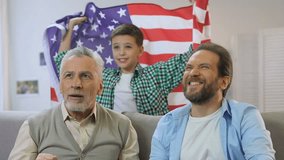 Boy waving American flag, family watching national football team match at home - Powered by Shutterstock - Get 15% off with code: PIKWIZARD15